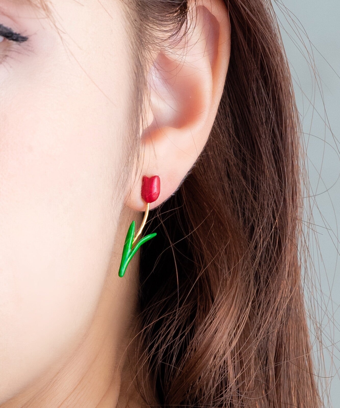 Birth Flower Earrings on ear